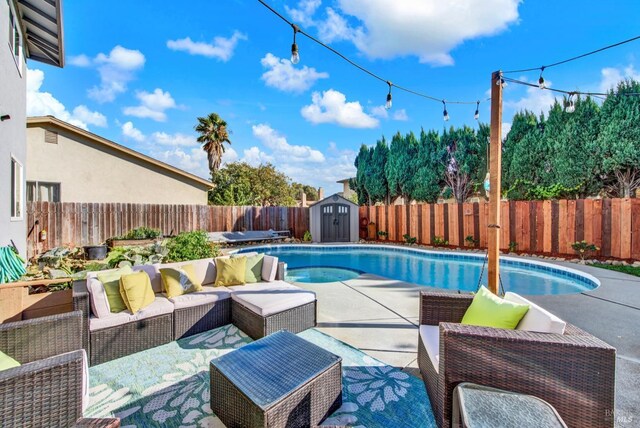 view of swimming pool with a storage shed and a yard