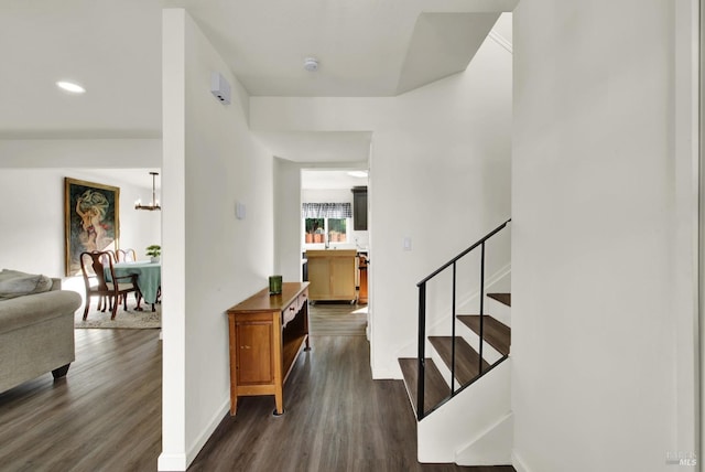 interior space featuring hardwood / wood-style flooring and a chandelier