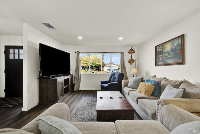 living room with wood-type flooring and a chandelier