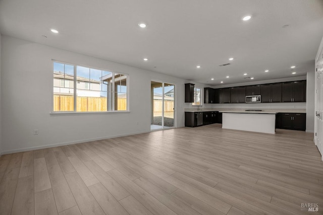 unfurnished living room featuring light hardwood / wood-style flooring