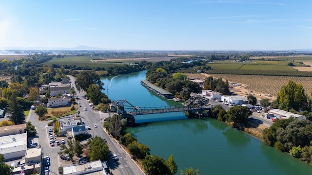 birds eye view of property with a water view and a rural view