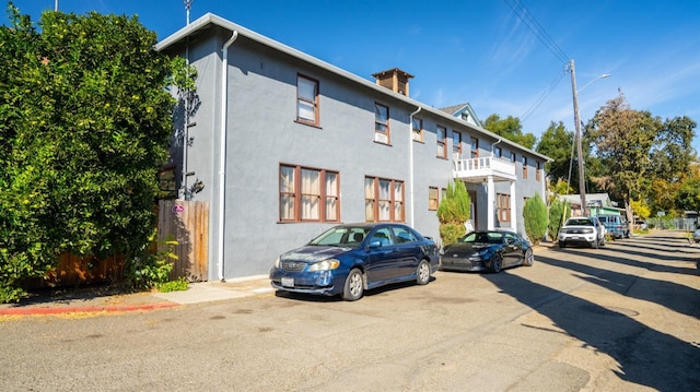 14090 Winnie St, Walnut Grove, CA 95690 - view of front of home with stucco siding and a chimney