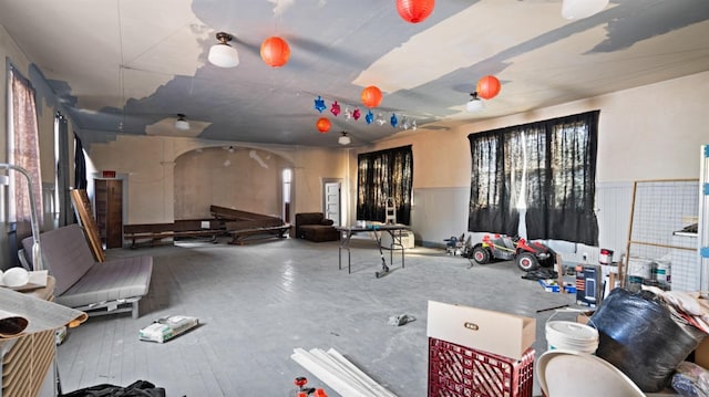 14090 Winnie St, Walnut Grove, CA 95690 - misc room featuring arched walkways and a wainscoted wall