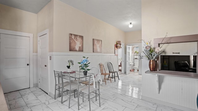 14090 Winnie St, Walnut Grove, CA 95690 - dining area featuring marble finish flooring and wainscoting