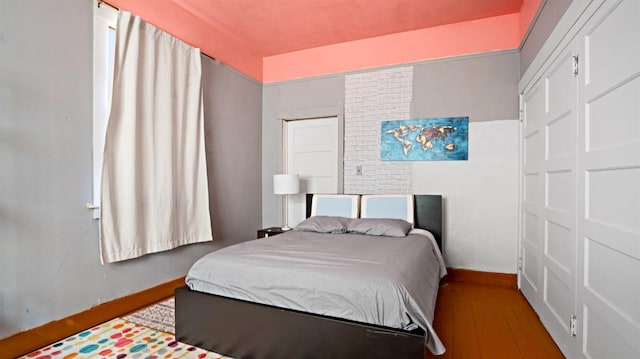 bedroom featuring wood-type flooring