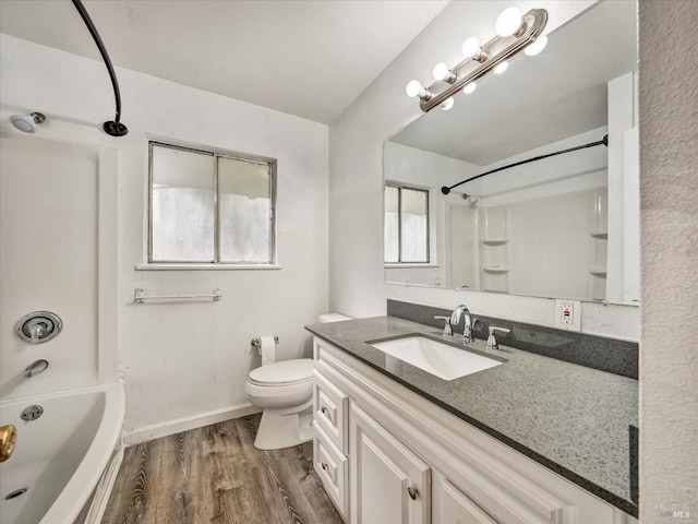 full bathroom with vanity, bathing tub / shower combination, toilet, and wood-type flooring