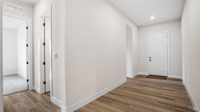 corridor featuring light wood-type flooring