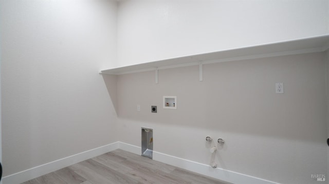 laundry room with hookup for a gas dryer, hookup for an electric dryer, light hardwood / wood-style flooring, and hookup for a washing machine