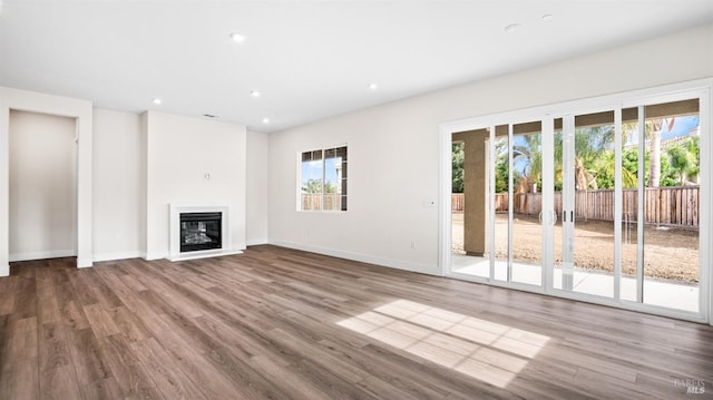 unfurnished living room featuring hardwood / wood-style floors