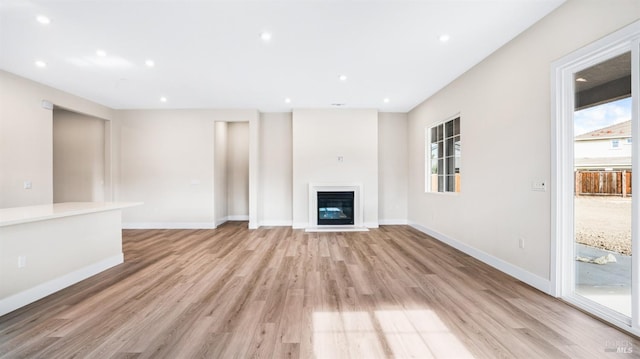 unfurnished living room with light wood-type flooring