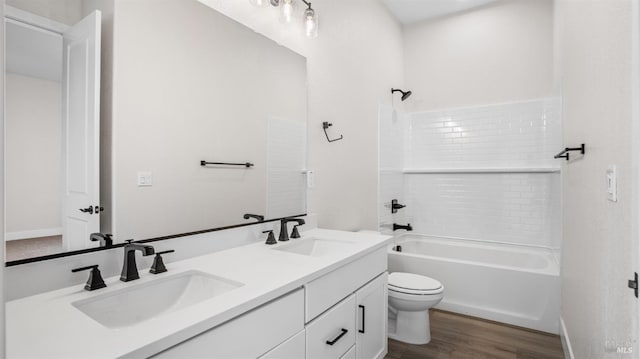 full bathroom featuring vanity, shower / bathing tub combination, wood-type flooring, and toilet