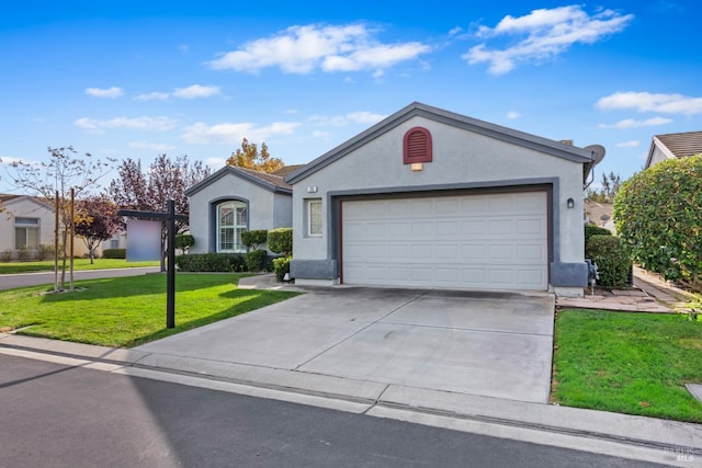 ranch-style home with a front yard and a garage