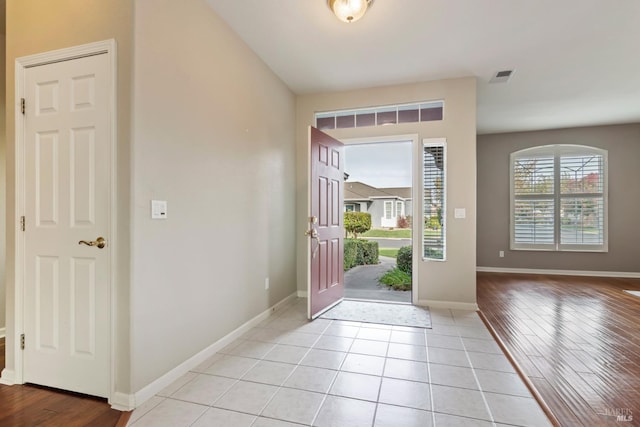 foyer entrance with light hardwood / wood-style flooring