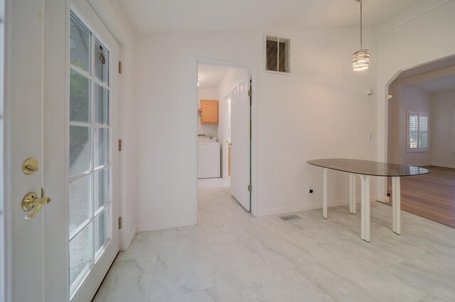 unfurnished dining area featuring washer / dryer