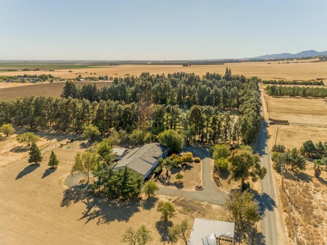 birds eye view of property with a rural view