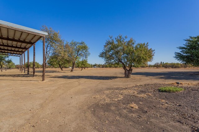 view of yard with a rural view