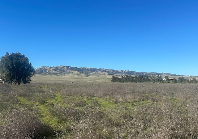 property view of mountains featuring a rural view