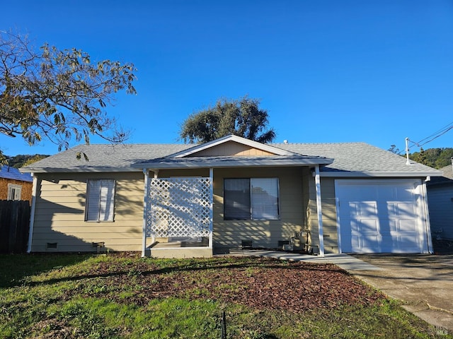 view of front of home featuring fence, an attached garage, and driveway