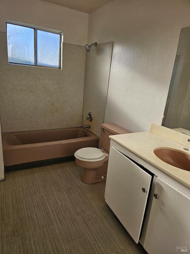 full bath featuring bathing tub / shower combination, vanity, and toilet