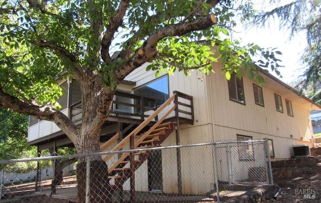 view of side of property featuring central AC unit