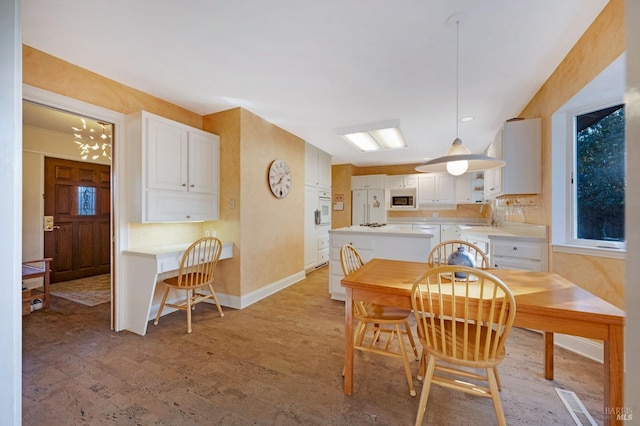 dining room with light hardwood / wood-style floors and sink