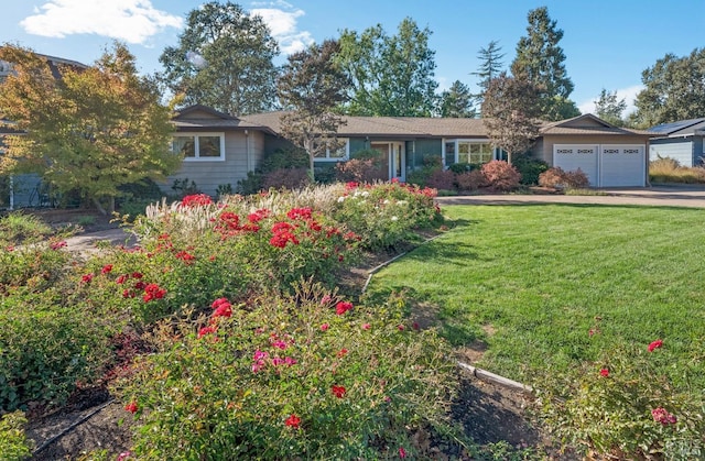 ranch-style house with a front yard and a garage