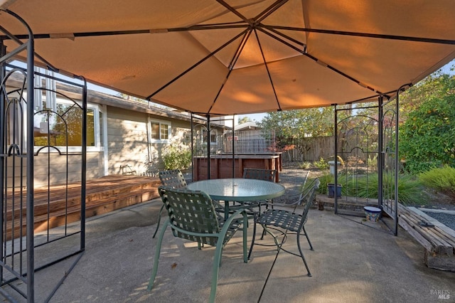 view of patio / terrace with a hot tub