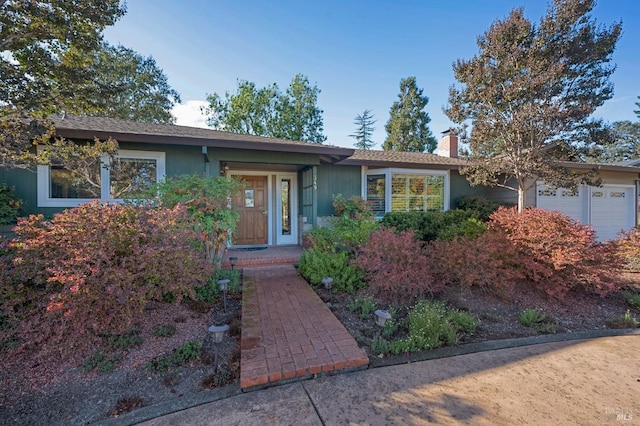 ranch-style house featuring a garage