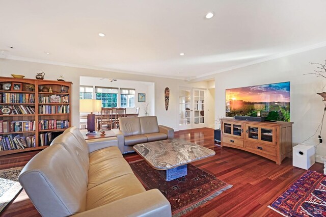 living room with french doors, ornamental molding, and dark hardwood / wood-style flooring