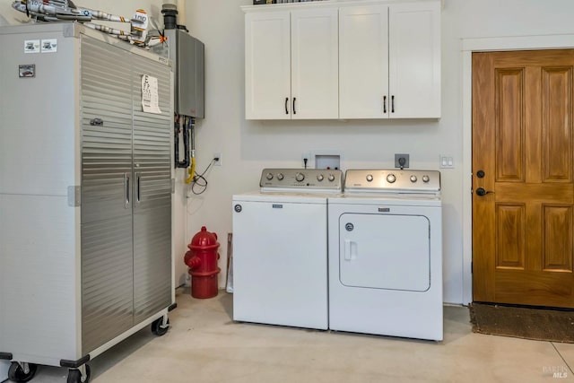 washroom with cabinets and washer and clothes dryer