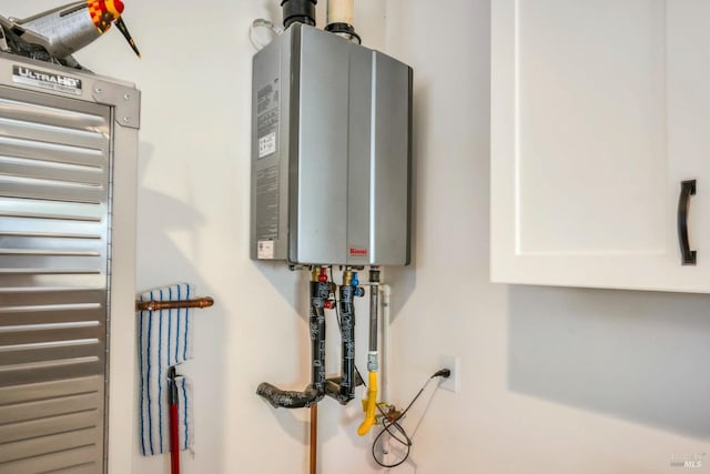 utility room with water heater