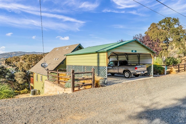 view of front of house featuring a mountain view and a carport