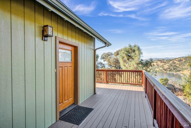 wooden deck with a water view