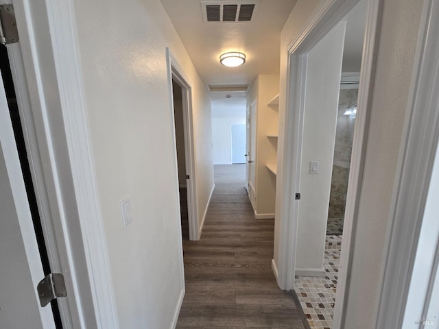 hallway featuring dark hardwood / wood-style floors