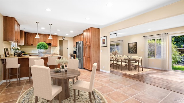 dining area featuring light tile patterned floors