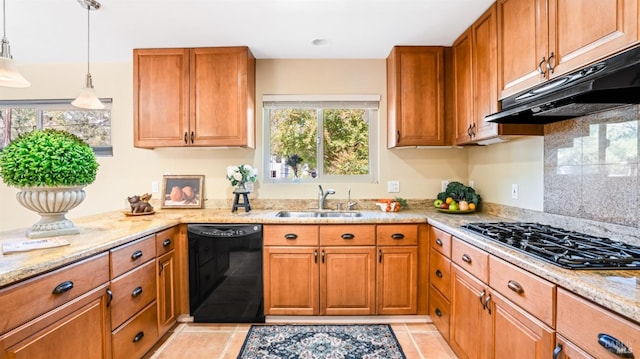 kitchen featuring sink, light tile patterned flooring, pendant lighting, black appliances, and light stone countertops