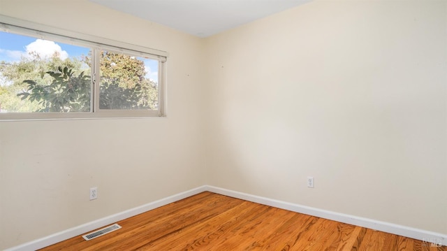 empty room featuring hardwood / wood-style floors