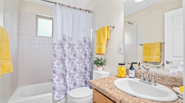 full bathroom featuring shower / tub combo with curtain, vanity, and toilet