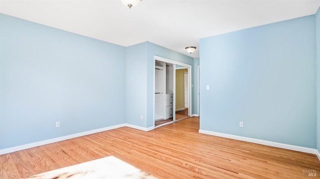 spare room featuring light hardwood / wood-style flooring