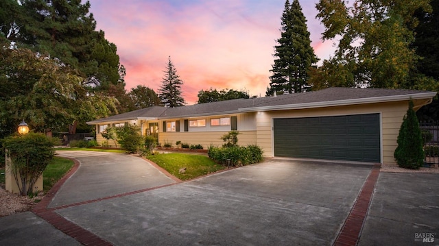 single story home featuring a garage