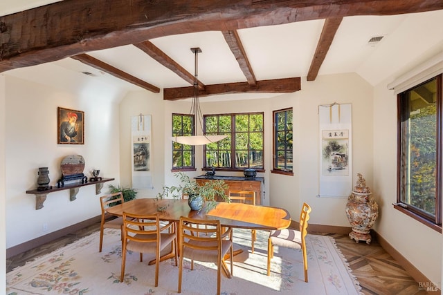 dining room with vaulted ceiling with beams, parquet flooring, and a wealth of natural light
