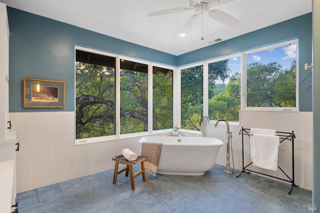 sunroom with ceiling fan and plenty of natural light