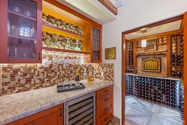 wine room featuring a wall unit AC, light parquet flooring, and beverage cooler