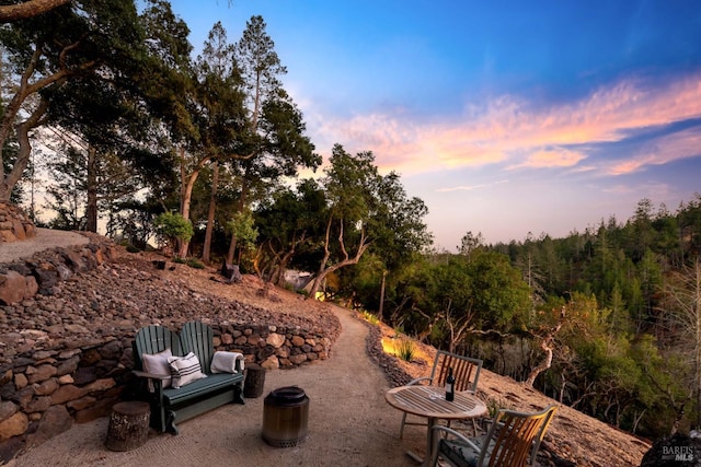 patio terrace at dusk with a fire pit