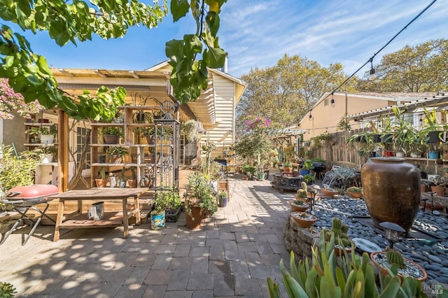 view of patio / terrace featuring fence