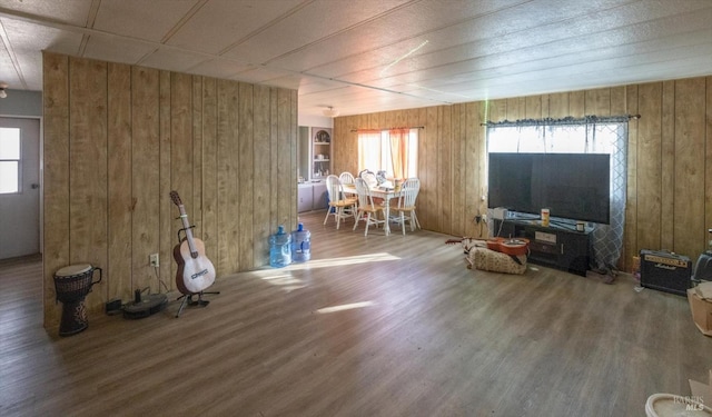 interior space featuring hardwood / wood-style floors and wood walls