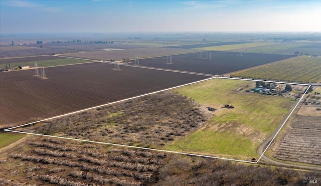 birds eye view of property featuring a rural view