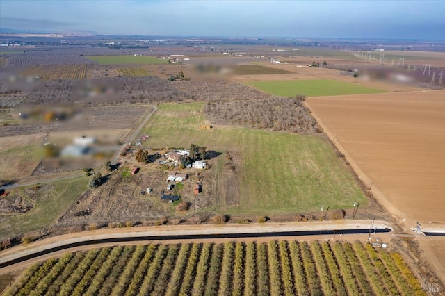 birds eye view of property with a rural view