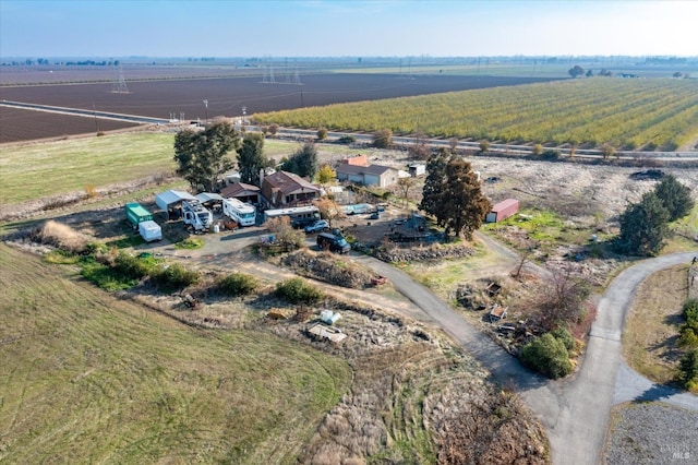 birds eye view of property with a rural view