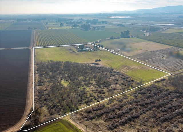 drone / aerial view featuring a rural view and a water view